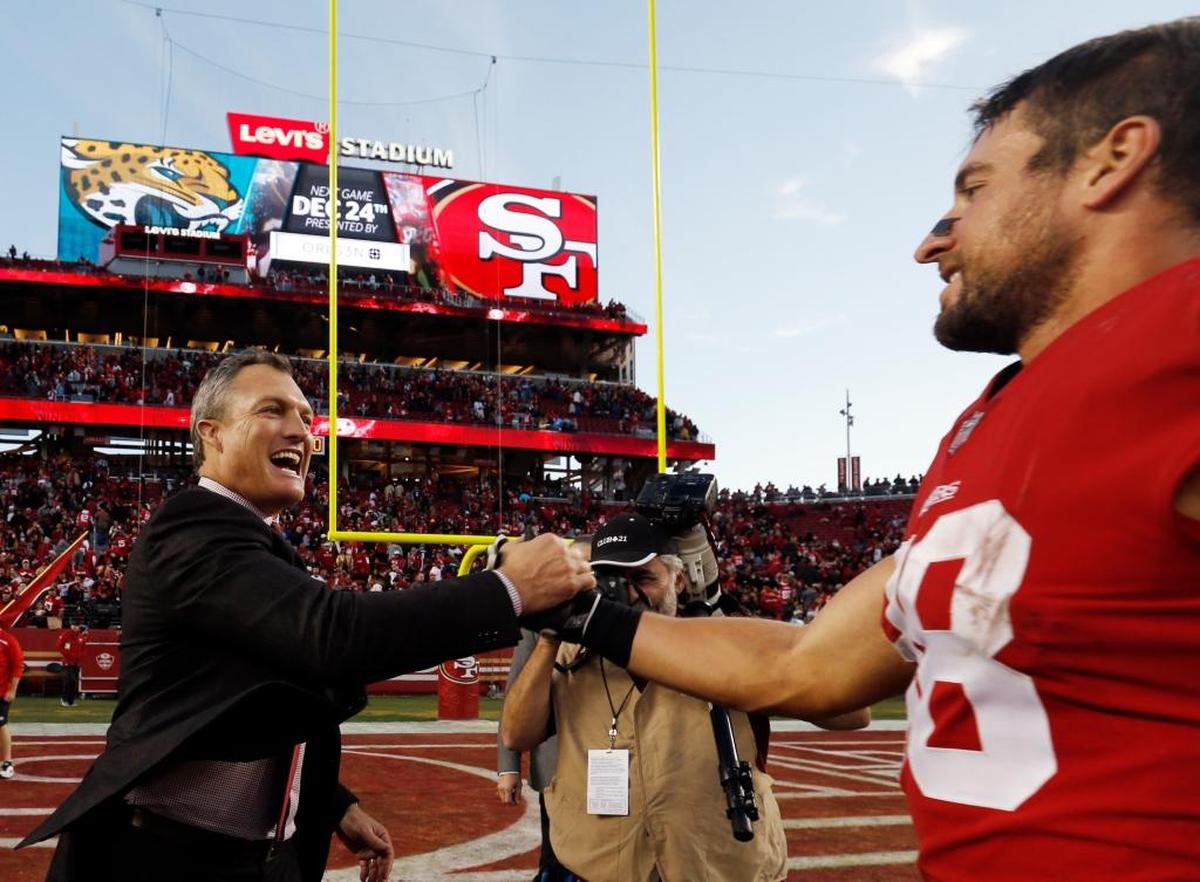 San Francisco 49ers general manager John Lynch, left, shakes hands with offensive guard Zane Beadles after a 25-23 win over the Tennessee Titans on Sunday, Dec. 17, 2017, in Santa Clara.