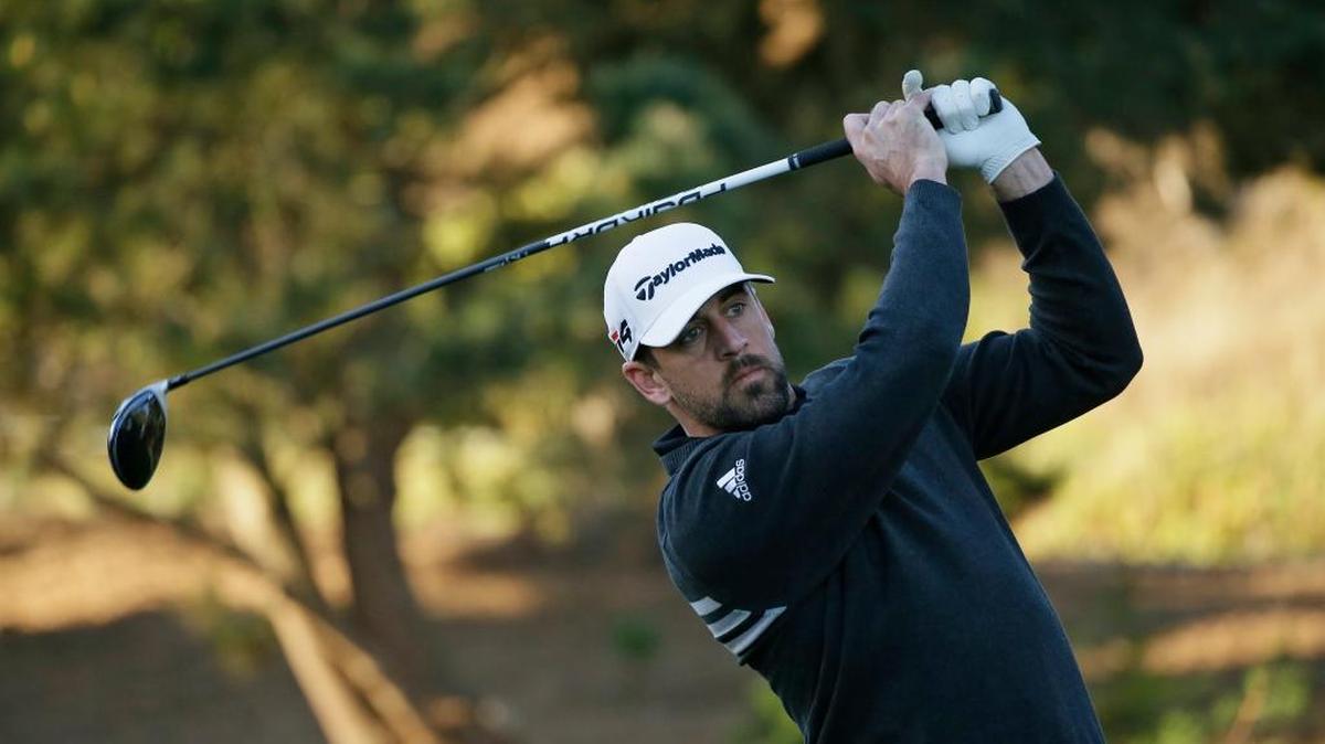 Aaron Rodgers follows his drive from the first tee of the Spyglass Hill Golf Course during the first round of the AT&T Pebble Beach National Pro-Am golf tournament Thursday, Feb. 8, 2018, in Pebble Beach, Calif.
