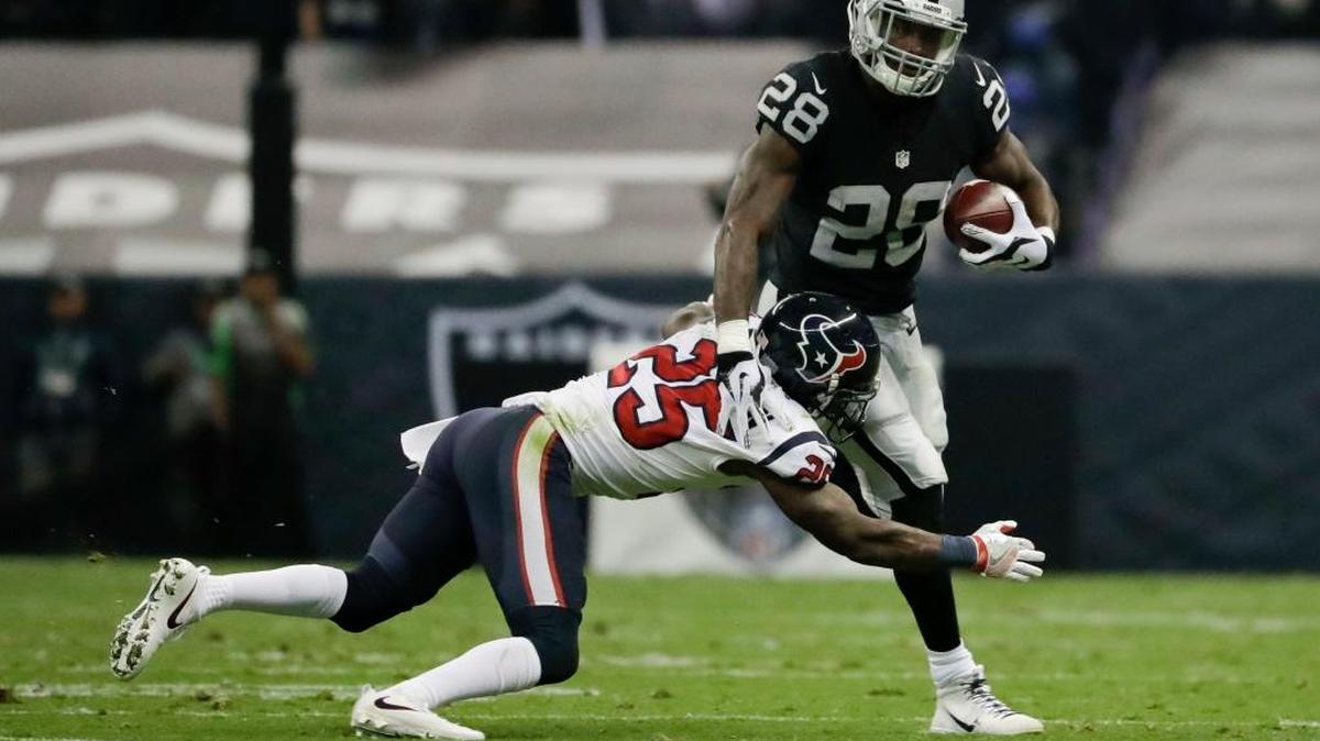 Oakland Raiders running back Latavius Murray (28) is brought down by Houston Texans cornerback Kareem Jackson (25) during the first half of an NFL football game Monday, Nov. 21, 2016, in Mexico City. Murray caught five passes in the Raiders’ victory and had more receiving yards (59) than rushing yards (33).