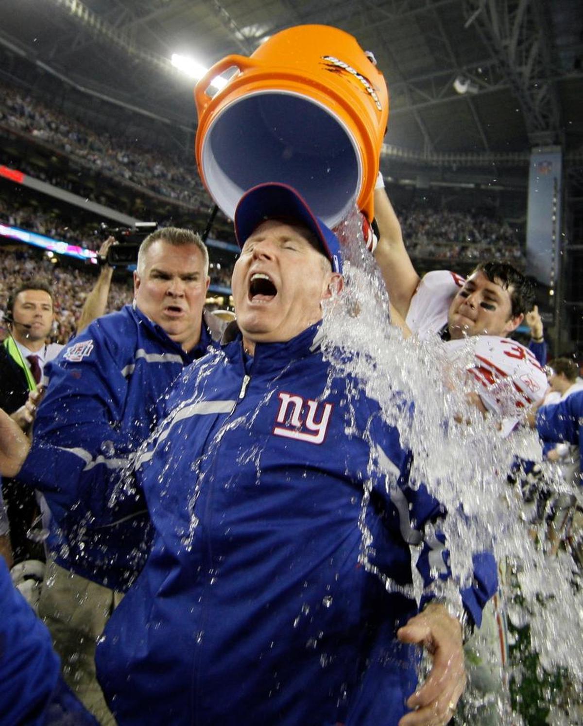 Former New York Giants coach Tom Coughlin is doused after beating the New England Patriots 17-14 in Super Bowl XLII. Coughlin is now the executive vice president of football operations for the Jacksonvillee Jaguars.