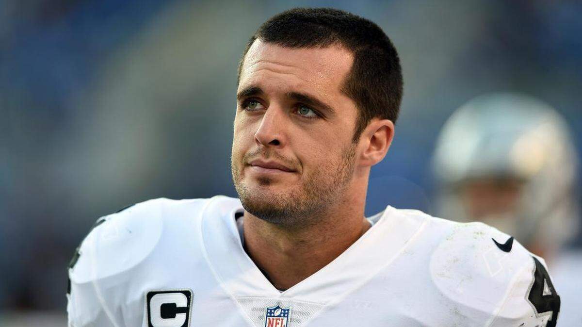 Oakland Raiders quarterback Derek Carr walks on the sideline in the second half of Sunday’s game at Baltimore.
