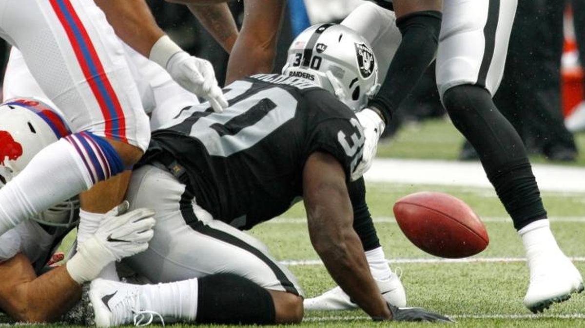 Oakland Raiders' Jalen Richard (30) fumbles a punt return during the second half of an NFL football game against the Buffalo Bills, Sunday, Oct. 29, 2017, in Orchard Park, N.J. (AP Photo/Jeffrey T. Barnes)