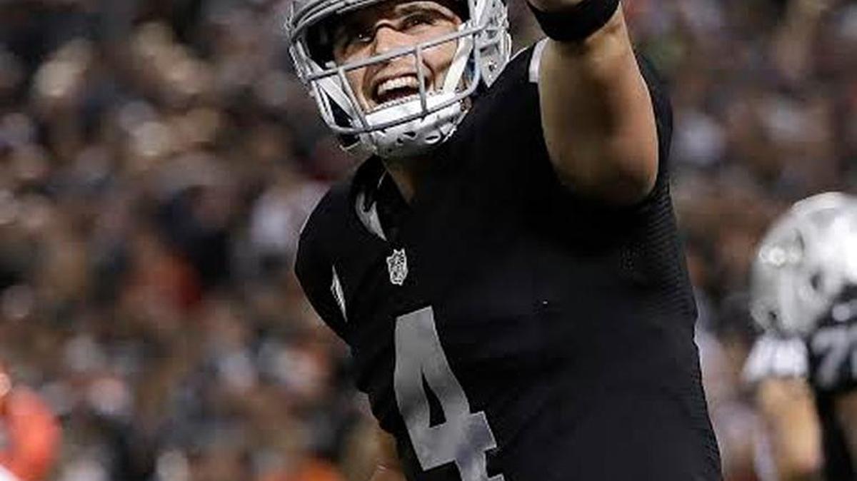 Oakland Raiders quarterback Derek Carr celebrates after a touchdown run by Latavius Murray during the second half against the Denver Broncos in Oakland on Nov. 6, 2016. The Raiders won 30-20 to take over sole possession of first place in the AFC West at 7-2 heading into their bye week.