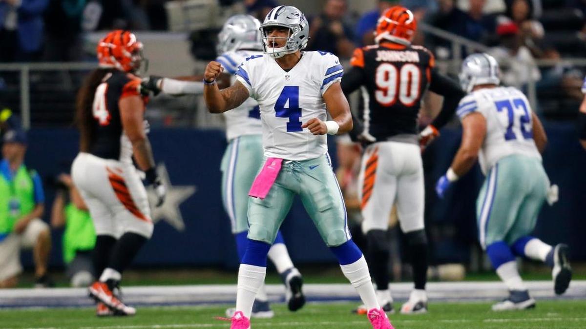 Dallas Cowboys quarterback Dak Prescott celebrates a touchdown scored against the Cincinnati Bengals in an NFL football game, Sunday, Oct. 9, 2016, in Arlington.