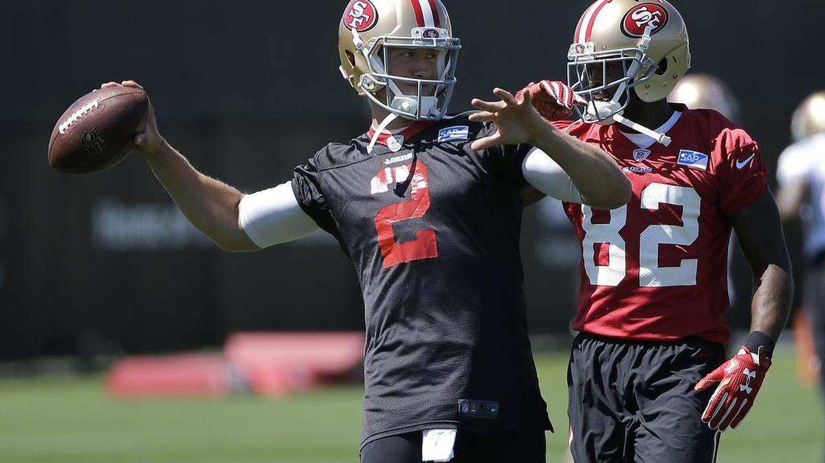 San Francisco 49ers quarterback Blaine Gabbert (2) throws next to wide receiver Torrey Smith (82) during practice at the team’s facility in Santa Clara on Tuesday, May 17, 2016.