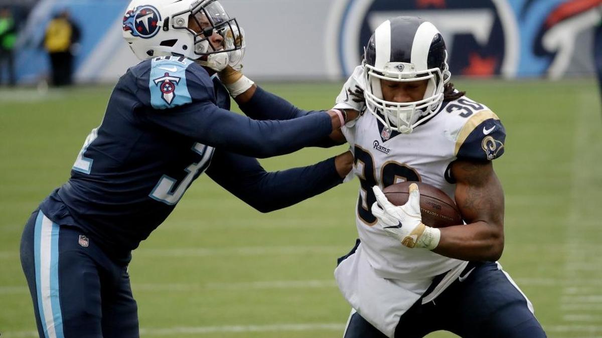 Los Angeles Rams’ running back Todd Gurley (30) tries to push away from Tennessee Titans free safety Kevin Byard, left, in the second half of the Rams’ 27-23 victory Sunday, Dec. 24, 2017, in Nashville, Tenn. Gurley has scored eight touchdowns in his past three games, five rushing and three receiving.