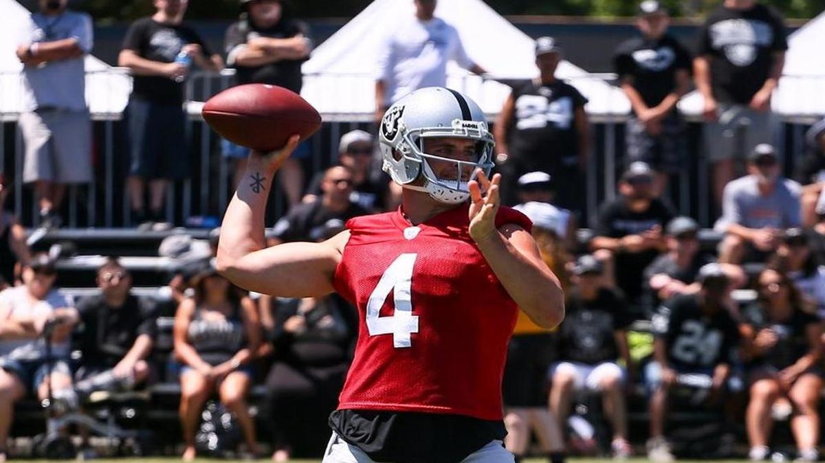 Oakland Raiders quarterback Derek Carr throws a pass during the second day of practice at training camp in Napa on Sunday, July 30, 2017.