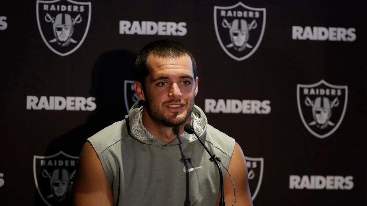 Oakland Raiders quarterback Derek Carr speaks during a press conference at the Hilton London Wembley hotel in London, Friday, Oct. 12, 2018. The Oakland Raiders arrived in Britain Friday for an NFL regular season game against the Seattle Seahawks in London on Sunday.