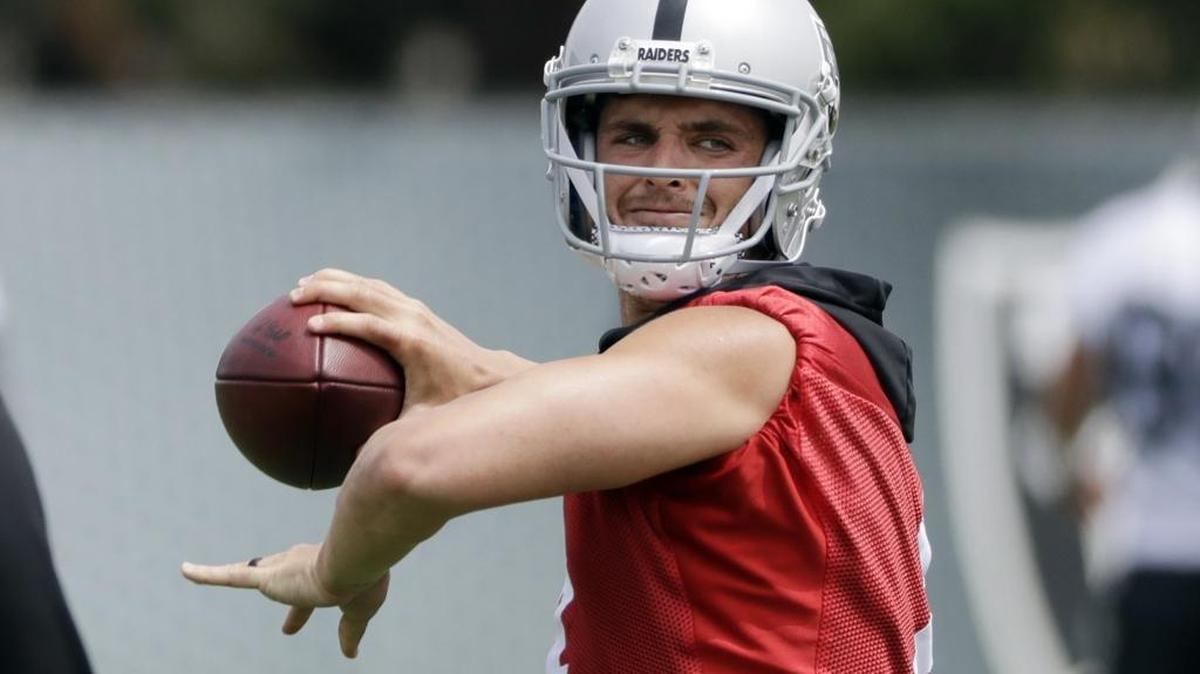 Oakland quarterback Derek Carr throws during offseason organized team activities Tuesday, May 30, 2017, at the Raiders’ training facility in Alameda.