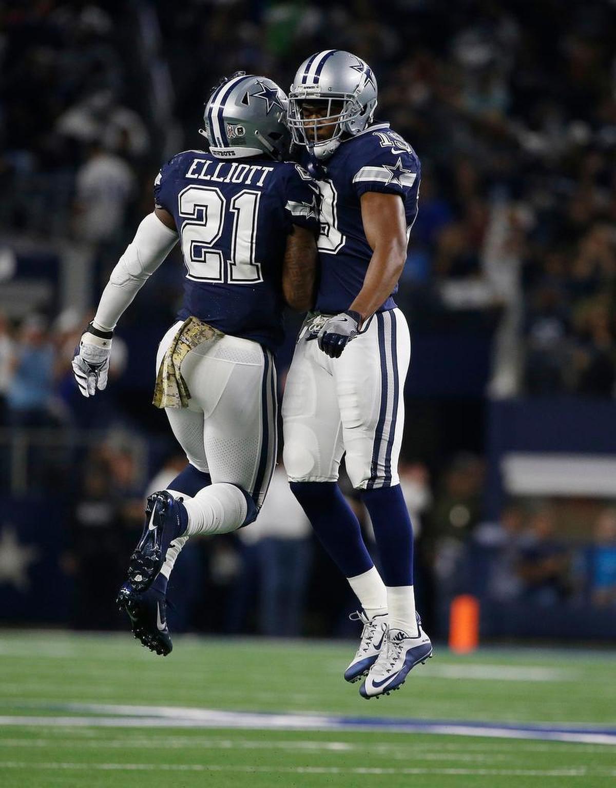 Dallas Cowboys wide receiver Amari Cooper (19) celebrates his touchdown with running back Ezekiel Elliott (21) during the first half of a 28-14 loss to the Tennessee Titans, Monday, Nov. 5, 2018, in Arlington, Texas.