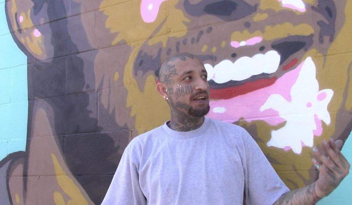 Omar “Super” Huerta describes his mural of Oakland Raiders quarterback Derek Carr on Sunday, July 14, 2019.