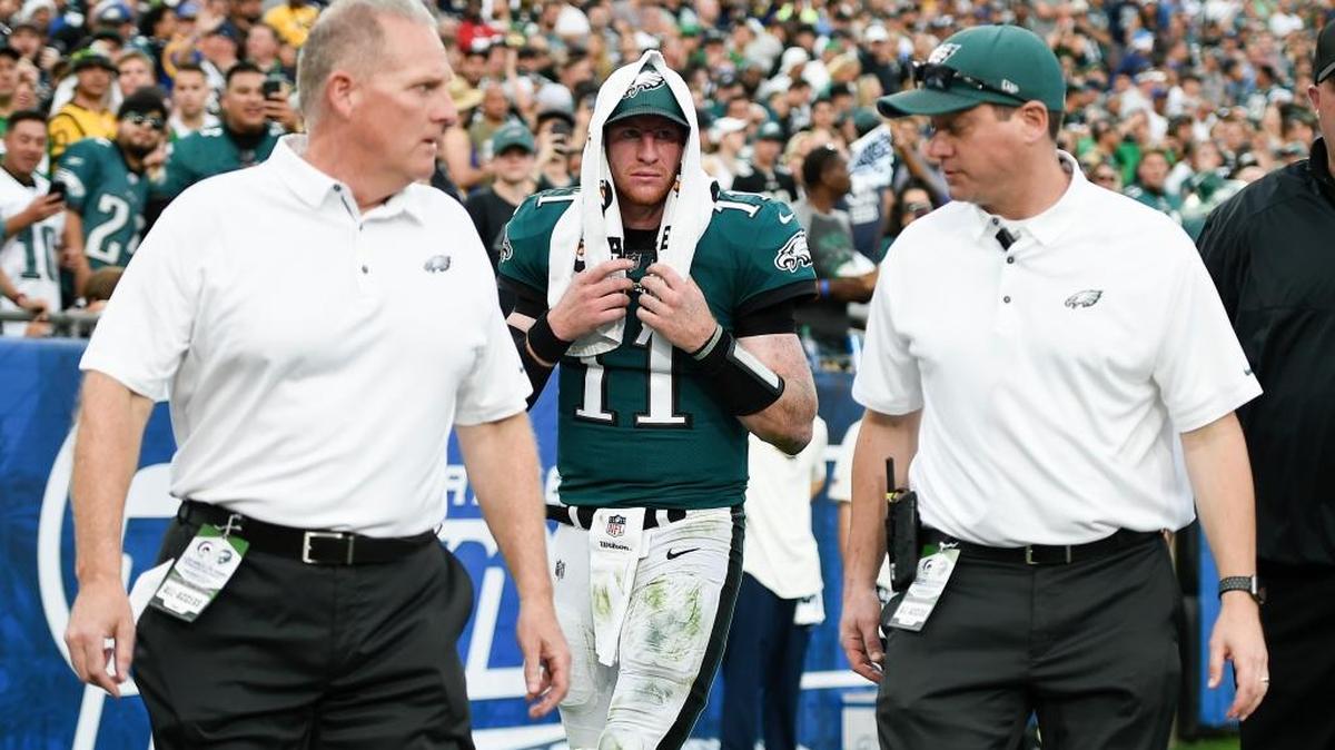 Philadelphia Eagles quarterback Carson Wentz walks off the field after being injured in the third quarter of a 43-35 victory over the Los Angeles Rams on Sunday, Dec. 10, 2017, in Los Angeles. Wentz tore his anterior cruciate ligament and will be sidelined for nine to 12 months.