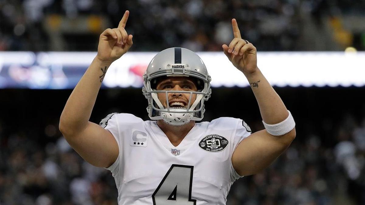 Oakland Raiders quarterback Derek Carr (4) reacts after throwing for a touchdown against the Kansas City Chiefs in Oakland, Calif., Thursday, Oct. 19, 2017.