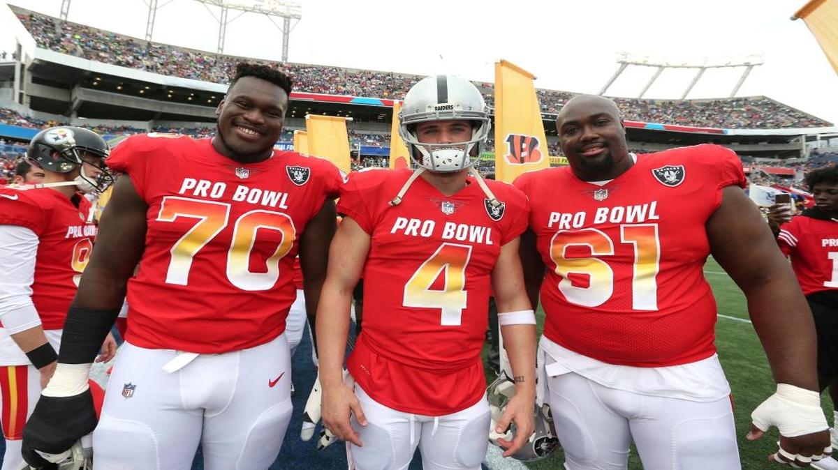 From left to right, AFC offensive guard Kelechi Osmele, AFC quarterback Derek Carr, and AFC center Rodney Hudson, all of the Oakland Raiders, pose for a photo prior to the NFL Pro Bowl at Camping World Stadium, Sunday, Jan. 28, 2018, in Orlando, Fla.