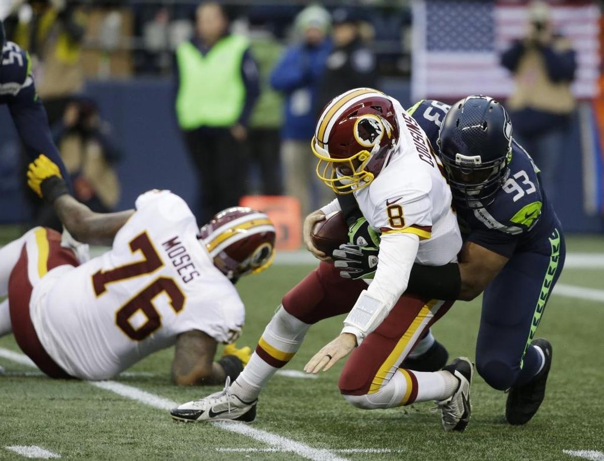 Sixteen-year veteran Dwight Freeney sacks Redskins quarterback Kirk Cousins in the Nov. 5 game. Freeney, waived this week by Seattle after fou games with the Seahawks, ranks as former NFL quarterback David Carr’s scariest opponent because of his speed and his spin move off the line.