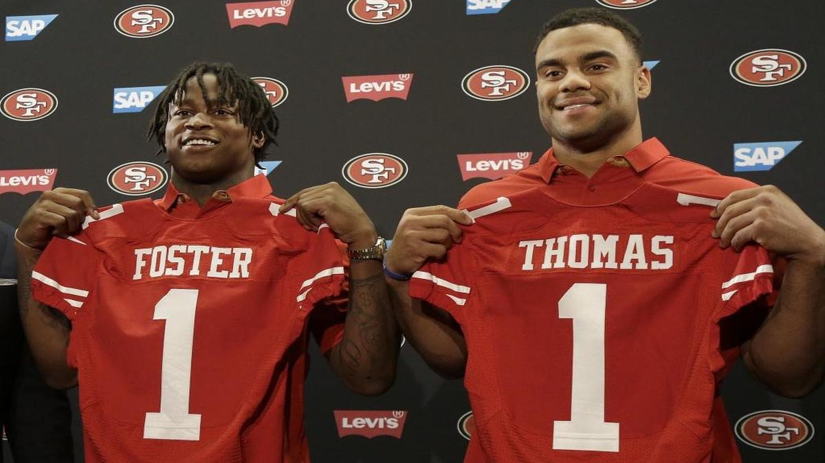San Francisco 49ers draft picks Reuben Foster, left, and Solomon Thomas pose for photos at a news conference in Santa Clara on Friday.