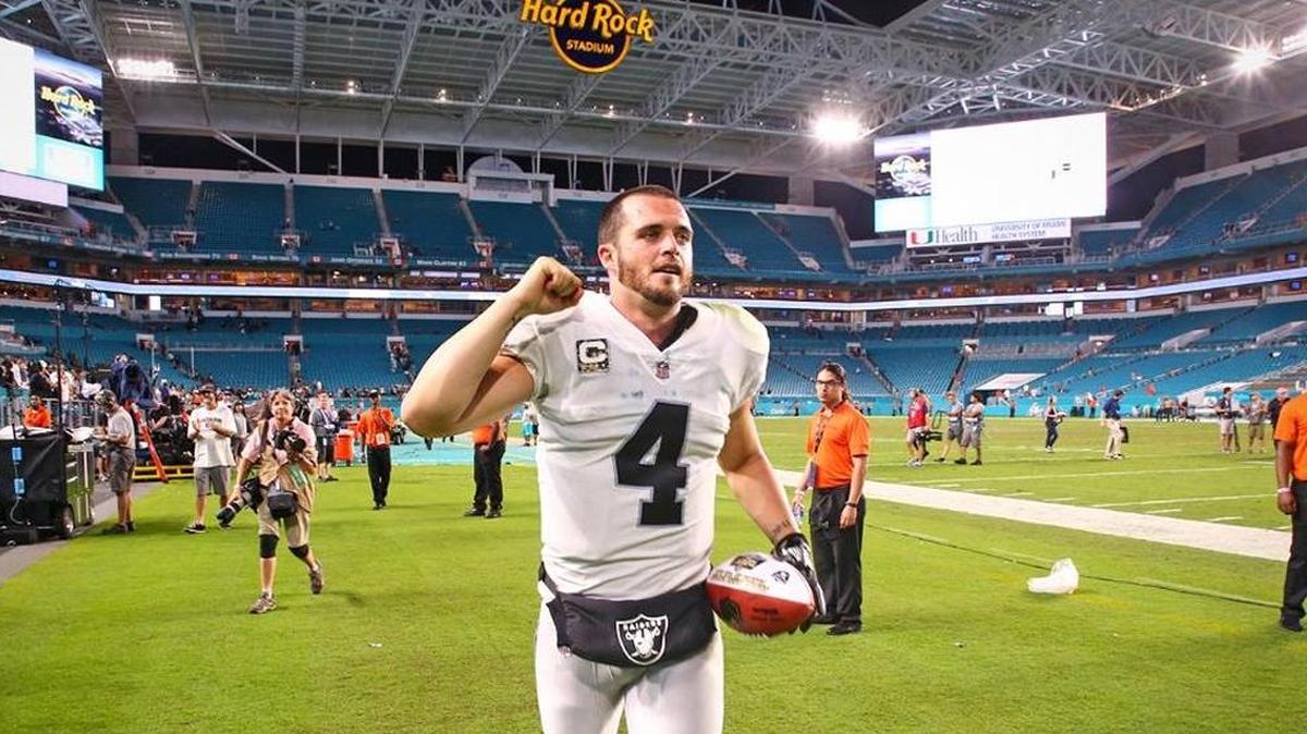 Oakland Raiders quarterback Derek Carr runs off the field after a 27-24 victory over the Miami Dolphins on Sunday, Nov. 5, 2017.
