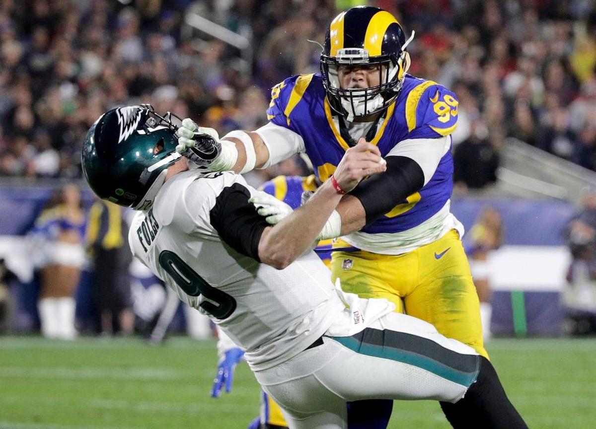 Los Angeles Rams defensive end Aaron Donald smacks Philadelphia Eagles quarterback Nick Foles. The Rams know they’ve got to pressure Tom Brady early and often to have a chance in the Super Bowl, and they’ve been assembling the tools for this job all year long. They signed Ndamukong Suh to a free-agent deal, gave a record-breaking contract to Donald and acquired edge rusher Dante Fowler from Jacksonville down the stretch.