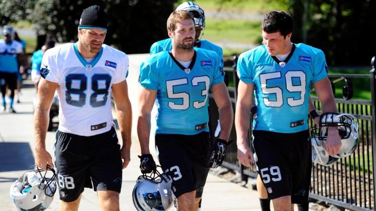 Former Fresno State standout Ben Jacobs of the Carolinga Panthers, at center heading to practice with teammates Greg Olsen (88) and Luke Kuechly (59) in 2015, agreed to terms on a two-year-extensions with the NFL team on Wednesday, Feb. 7, 2017.