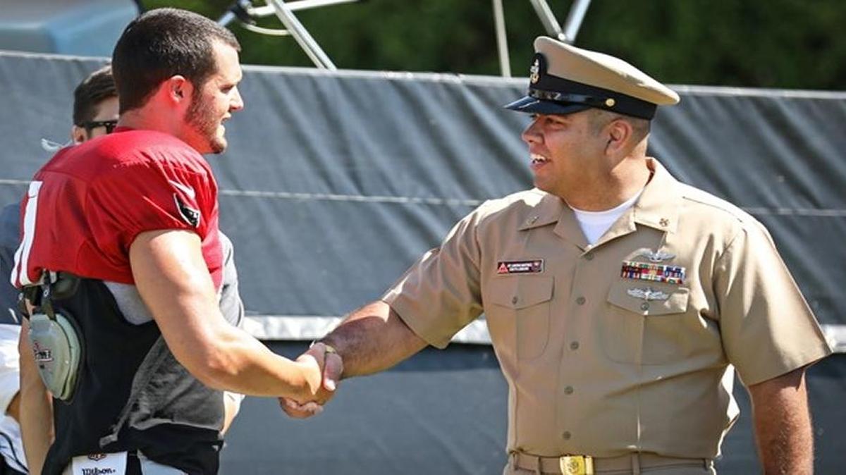 Oakland Raiders quarterback Derek Carr meets with Madera native and U.S. Navy Chief Petty Officer Matt Martinez at training camp in early August.