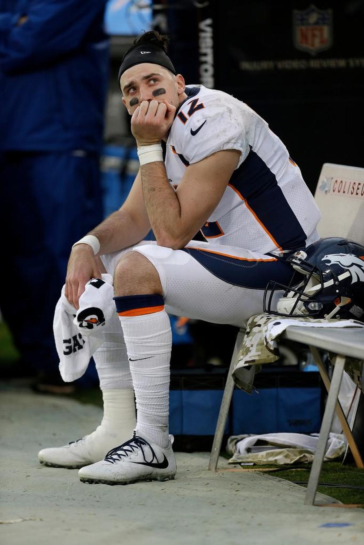 Broncos quarterback Paxton Lynch sits on the bench during the second half of a 21-14 loss to the Oakland Raiders in Oakland, Sunday, Nov. 26, 2017. Lynch completed 9 of 14 passes for only 41 yards. He also threw one interception and was sacked four times.