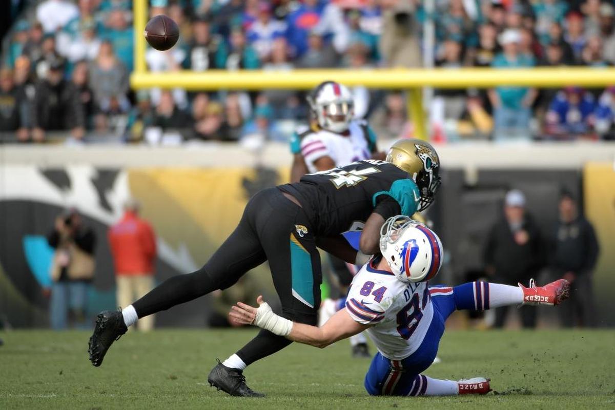 Jacksonville outside linebacker Myles Jack separates the football from Buffalo tight end Nick O’Leary during the Jaguars’ 10-3 victory in anAFC wild-card playoff game Jan. 7, 2018.