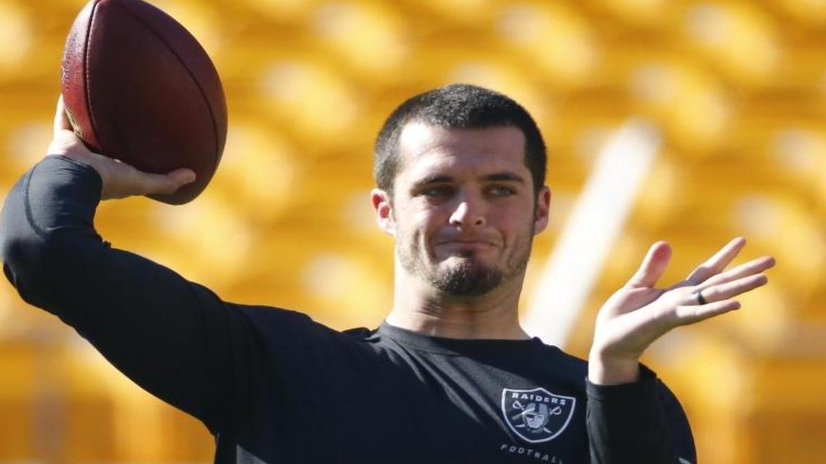 Oakland Raiders quarterback Derek Carr warms up before an NFL football game against the Pittsburgh Steelers, Nov. 8, 2015, in Pittsburgh.