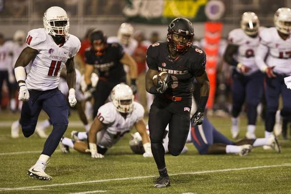 UNLV’s Charles Williams turns the corner on the Fresno State defense for a near score Saturday, Oct. 1, at Sam Boyd Stadium in Las Vegas.