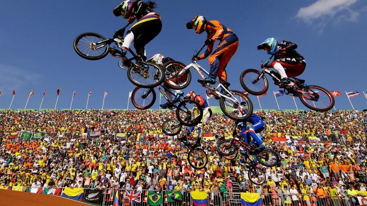 Mariana Pajon of Colombia, left, Laura Smulders of the Netherlands, center, and Brooke Crain of the United States compete in the women’s BMX finals Aug., 19, 2016, at the Summer Olympics in Rio de Janeiro, Brazil.