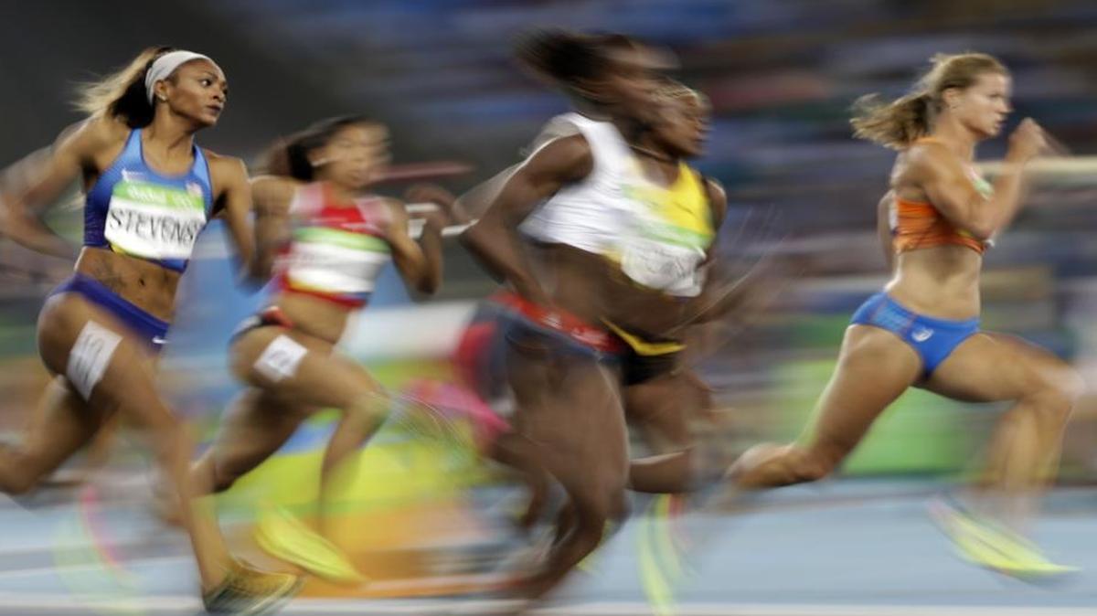 Former College of the Sequoias standout Deajah Stevens, left, competes in her women’s 200-meter semifinal Aug. 16 at the Rio Games. Stevens advanced to the Aug. 17 final and placed seventh in her first Olympics.