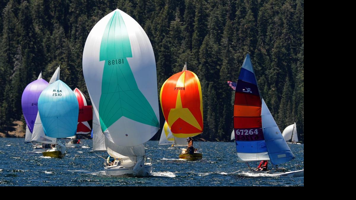
Sailboats approach the finish line at Huntington Lake during the 2013 High Sierra Regatta. The annual event has been called off for the second year in a row because of low-water levels caused by the drought.
