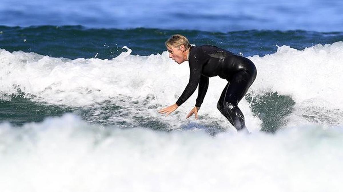 
Elinor Dempsey of Los Osos, who was unhurt in a shark attack in August, goes back into the ocean at Morro Bay near Morro Rock on Sept. 20 for the first time since the attack.
