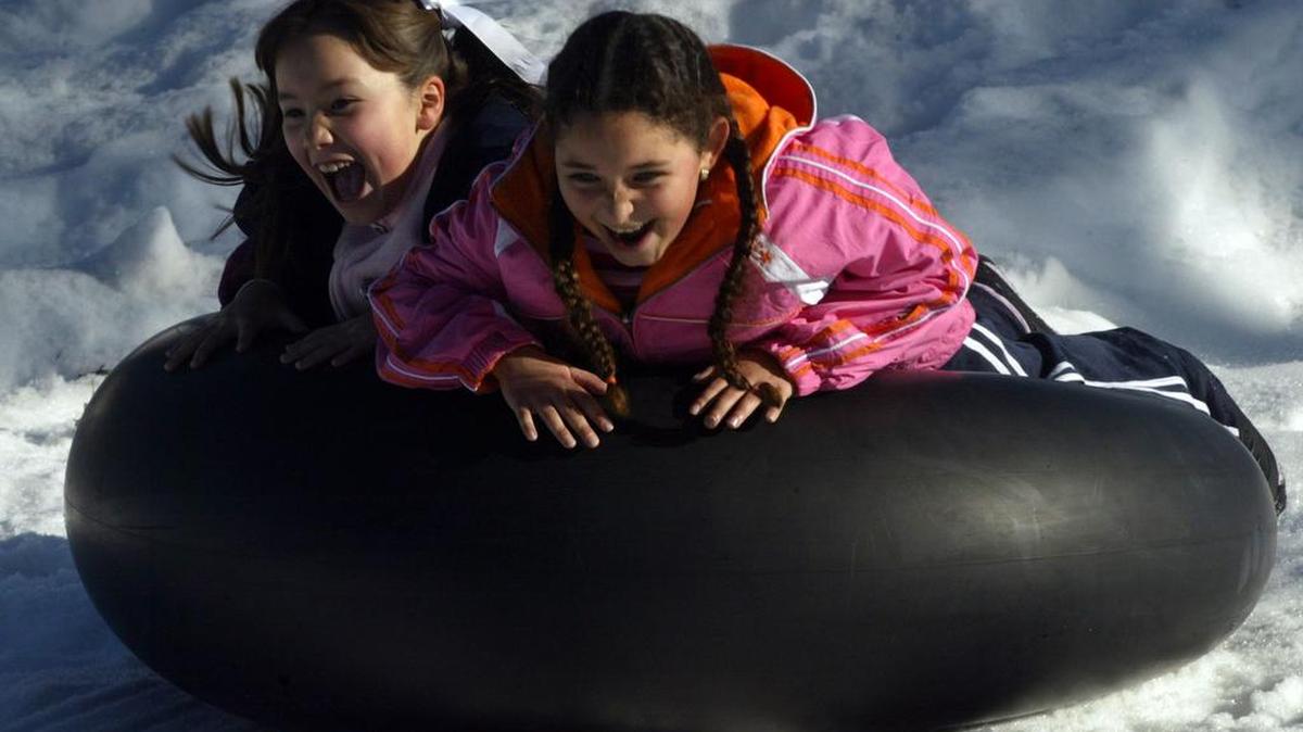 Nayeli Naranjo and Yamilex Calderon of Hanford slide down a slope at Balsam Meadow Sno-Park in this 2006 file photo. Winter storms are expected to dump 8 to 16 inches of snow in the Huntington Lake area Thursday afternoon and into early Christmas Day 2015.