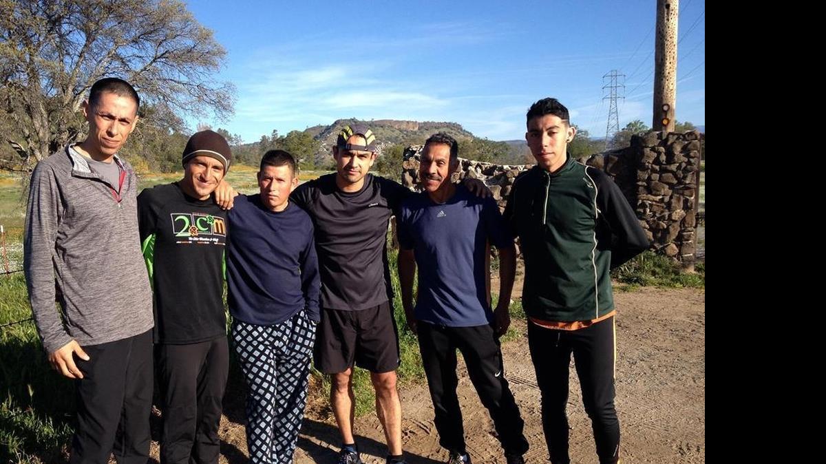 
Miguel Reyes, third from left, poses with Jesus Campos, second from left, and a group of runners before a training session. Reyes died in a car accident in March. On Sunday, Campos and friends will host the Miguel Reyes 5K at Woodward Park in his honor.
