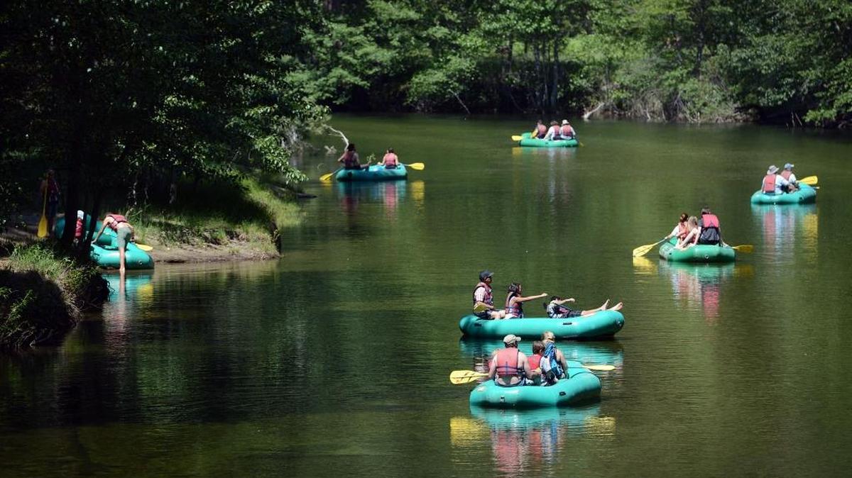 Rafters float along the Merced River in Yosemite Valley in June 2014. Reservations for Yosemite National Park summer campsites begin at 7 a.m. on Monday, Feb. 15.
