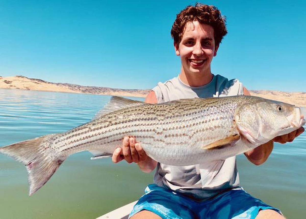 Sixteen-year-old Tyler Zuber of Fresno shows off his 38-inch, 22-pound striper (a personal best), caught Sept. 5 at San Luis Reservoir on a trip with guide Roger George.