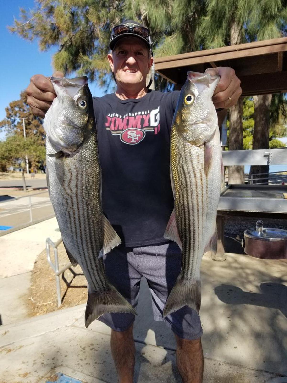 Fred Mishler shows off his catch Oct. 23 at San Luis Reservoir.