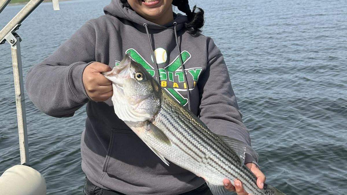 Deysey Valesquez Armenta, Roosevelt High School senior, holds the first fish she ever caught. The San Luis