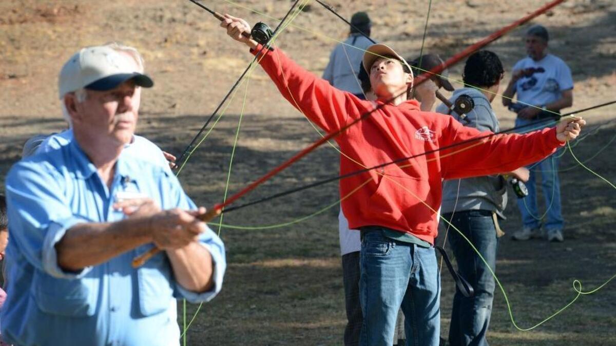 Visitors practice fly casting during the first SalmonFest at Lost Lake Park near Friant in 2013. The celebration on the San Joaquin River, which includes a fishing clinic and river eduction, returns Saturday from 10 a.m. to 5 p.m.