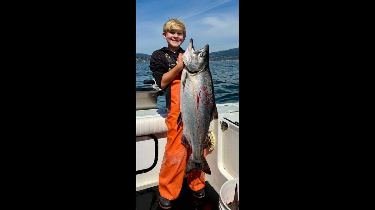 Axel Veerkamp, 14, of Placerville with a 38-pound, 46-inch salmon he caught trolling near Stinson Beach with Captain Trent Slate of Bite Me Charters.
