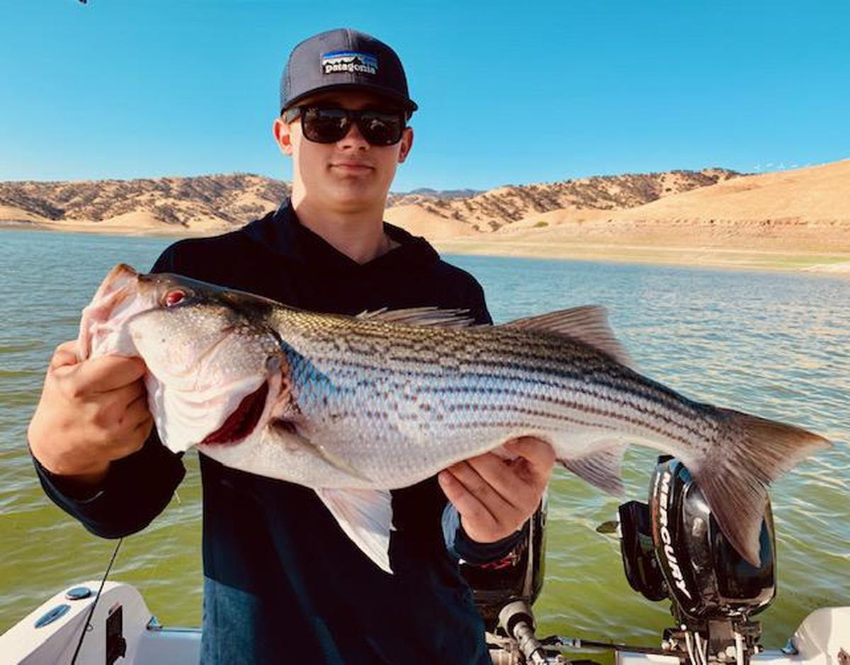 Fourteen-year-old Nick Stubblefield of Fresno shows off his 29-inch, 9-pound striper (a personal best), caught Sept. 5 at San Luis Reservoir on a trip with guide Roger George.