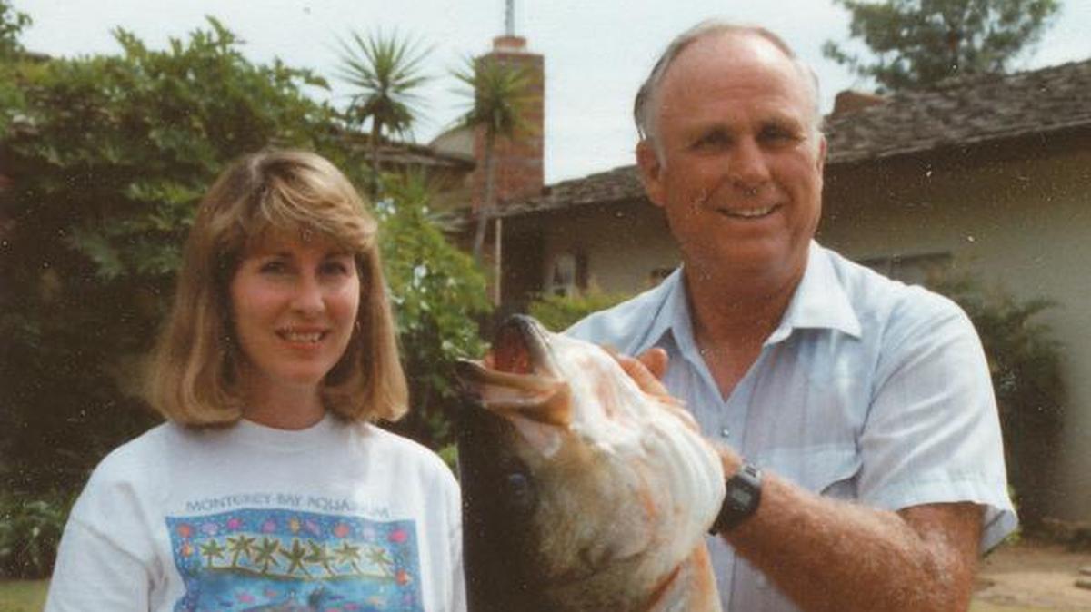Carol Hansen with her father, Warren George, and his 48-pound Millerton striper in 1993.