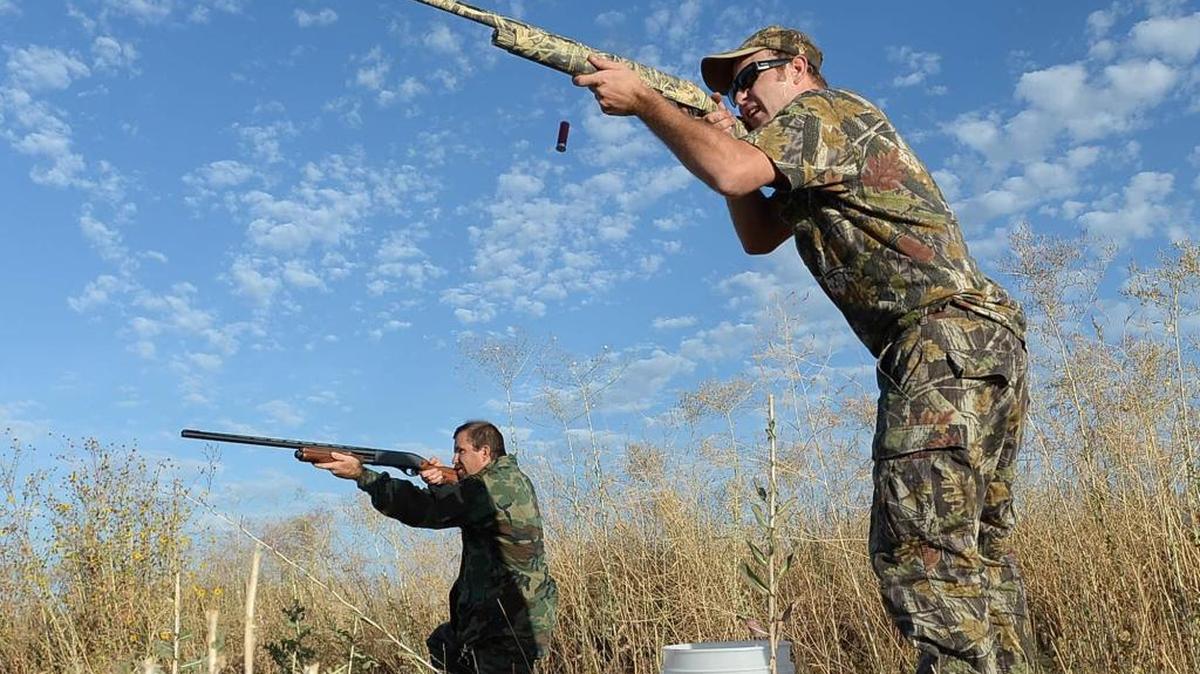 David Bennett, left, and Jeremy Stubbs take aim inside the Mendota Wildlife Area on the 2013’s opening day of dove season. Dove season opens for the first time in 2016 on Sept. 1.