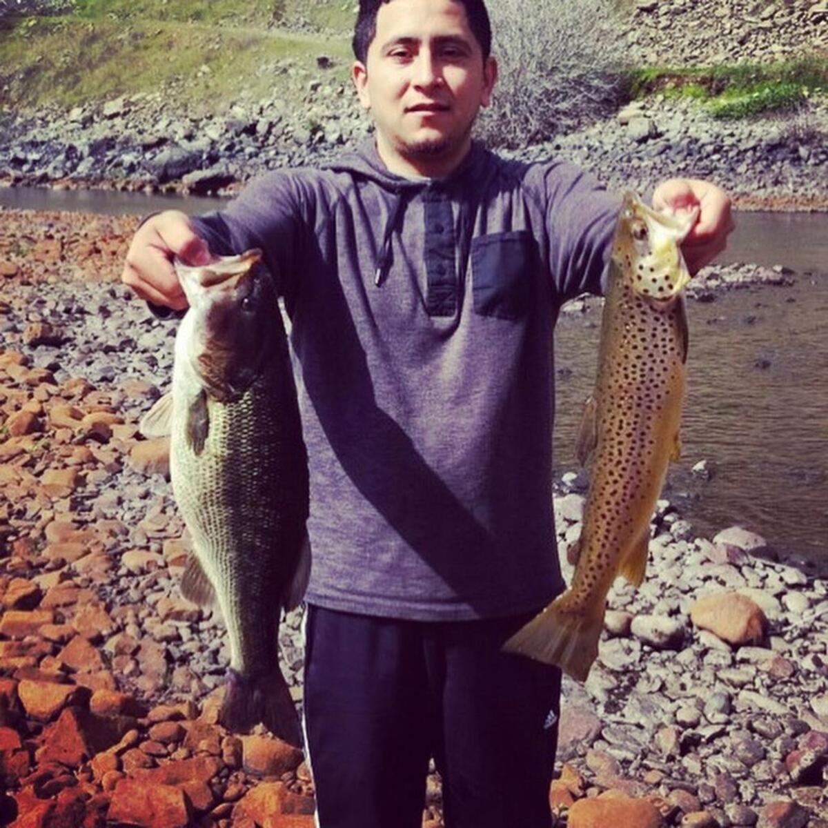 Daniel Anaya shows off his personal-best bass, left, and his first brown trout.