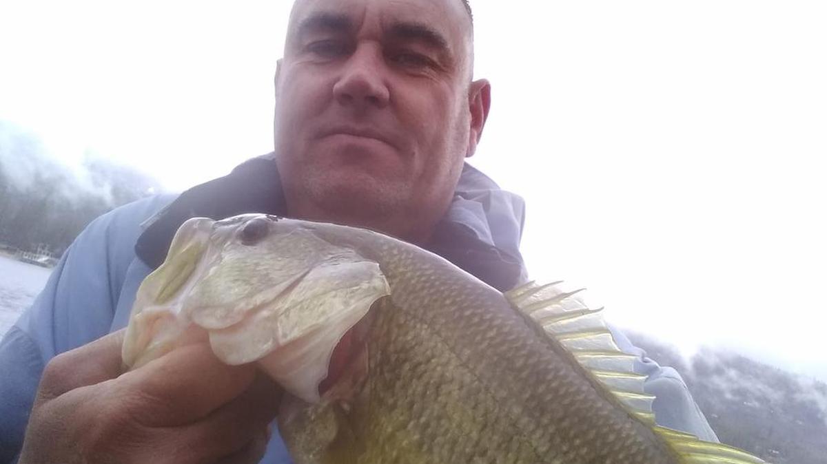 Nathan Bibb shows off the “hog” he caught at Bass Lake.