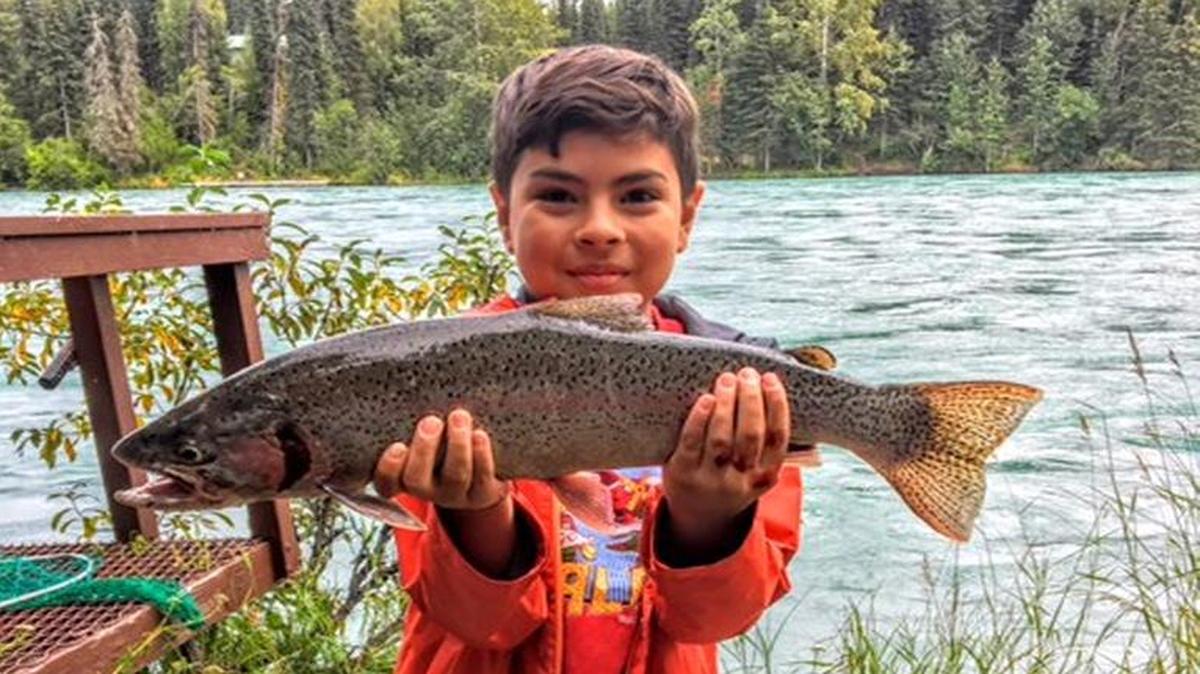 Jacob Wall shows off the rainbow trout he caught last month on the Kenai River in Alaska. The fifth-grader at Our Lady of Victory in Fresno was visiting his grandfather, Ernie Wall.