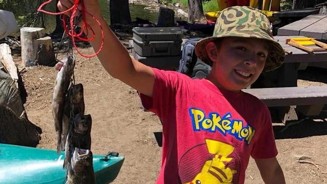 Dimitri Glessner, 10, shows off his stringer of trout caught Wednesday, June 20 at Huntington Lake.