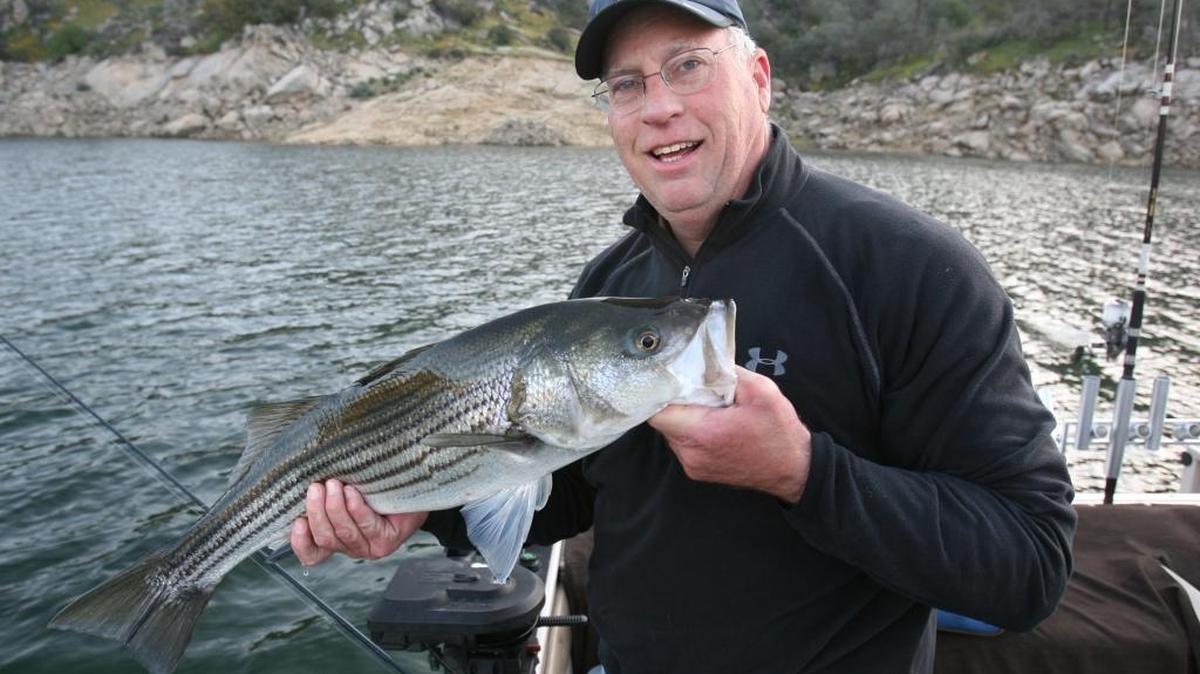 Roger George holds up a 10-pound striper caught in a favorite cove on Millerton Lake in this March 2009 photo. As much as fishing is about the thrill of the catch, taking a great photo afterward ensures the memory is a lasting one.