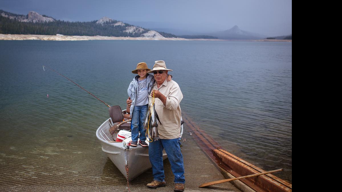 
Adam Gutierrez submitted this photo of 6-year-old son Gavin and his Grandpa, Albert Velasco, during their recent trip to Courtright Reservoir. Gutierrez said they all caught their limits within a few hours trolling the dam with flashers attached to wedding rings and pink or yellow salmon hoochies with night crawlers attached. The photo shows a stringer full of 15 rainbow trout ranging from 14-18 inches, he said.

