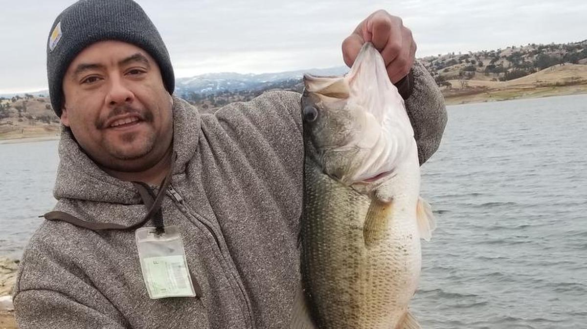 Vincent Garcia of Fresno shows off a largemouth bass estimated to be 14 pounds and 28 inches, caught around 9:30 a.m. Nov. 30 at Hensley Lake. Fishing partner Terry Saiz says, “We decided to bait fish to get deeper and behold.”